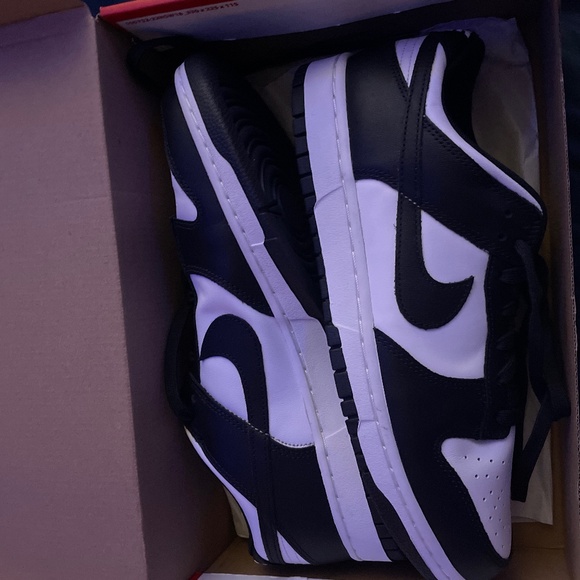 A pair of never worn Nike Panda Dunks